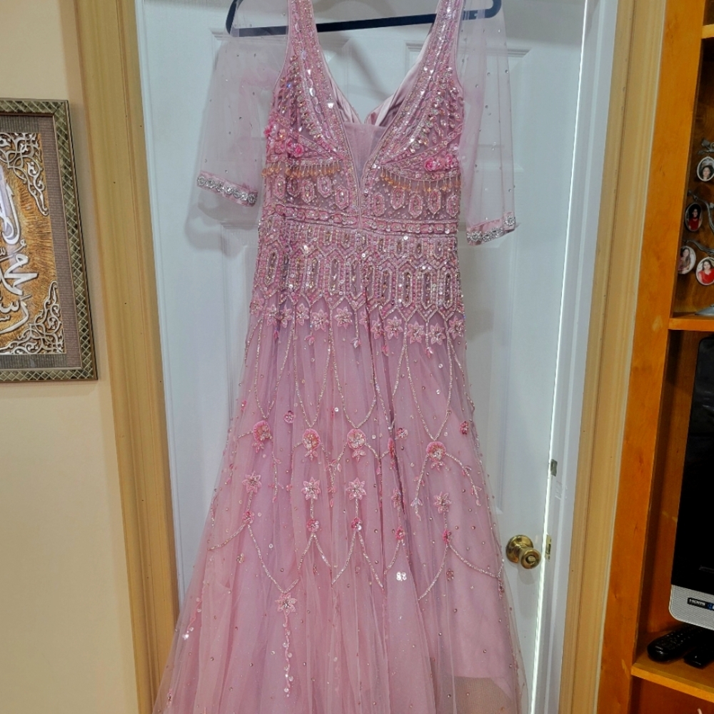 Formal party gown dress. Medium size, soft baby pink, brand new. Net material.